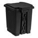 A black plastic Lavex step-on trash can with a lid.