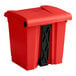 A red rectangular Lavex step-on trash can with a black lid.