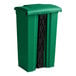 A green plastic bin with black handles.