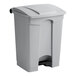 A gray Lavex step-on trash can with a black lid.