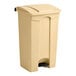 A beige plastic Lavex step-on trash can with a black lid and handle.