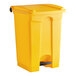 A yellow Lavex step-on trash can with a black handle.