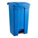 A blue plastic Lavex step-on trash can with a lid.