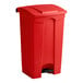 A red plastic Lavex step-on trash can with a black lid.