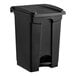 A black Lavex step-on trash can with a lid.