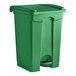 A green Lavex step-on trash can with a lid.