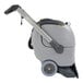 A grey and black Advance ES300 carpet extractor with wheels and a handle.