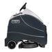 A black and white Advance SC1500 floor scrubber with wheels.