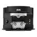 A black and silver PUQpress M5 automatic espresso tamper on a table next to a black and silver coffee machine.