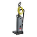 An Advance Spectrum 12P upright vacuum cleaner with a yellow tube attached.