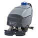 An Advance SC750 cordless walk behind floor scrubber with blue and grey accents and wheels.