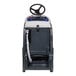 A white and blue Advance SC1500 stand-on floor scrubber with a steering wheel.