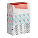 A stack of Puffs Basic 2-ply facial tissue boxes with different designs.