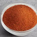 A bowl of Regal chili powder on a table.