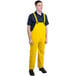 A man wearing yellow Cordova StormFront overalls.