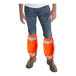 A man wearing Cordova Class E Hi-Vis orange mesh leg gaiters over jeans.