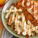A plate of food with Tajin Chamoy sauce on it.