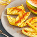 A plate of pineapple slices with Tajin seasoning.