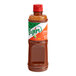 A close up of a bottle of Tajin Mild Hot Sauce with an orange label.