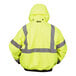 A person wearing a Cordova Hi-Vis Lime yellow Type R Class 3 bomber jacket with reflective tape on the back.