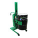 A green and black Valley Craft steel straddle drum lift and rotator with a handle and wheels holding a green and black barrel.