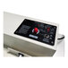 A white Sealer Sales I-Bar Sealer with a black panel and red button.