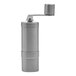 A close-up of a stainless steel Rhino Coffee Gear hand grinder with a lid.