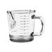 A clear Rhino Coffee Gear double spout shot glass with measuring lines.