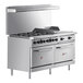 A large stainless steel Wolf commercial range with 6 burners, a griddle, and 2 ovens.