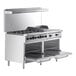 A large stainless steel Wolf commercial range with 6 burners, a griddle, and 2 ovens.