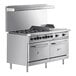 A Wolf stainless steel commercial gas range with 6 burners, a right side griddle, and 2 ovens.