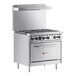 A large stainless steel Wolf commercial range with 6 burners and a standard oven.