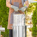 A man using a Choice aluminum stock pot to cook food.