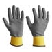 A close-up of a pair of gray and yellow Armor Guys Kyorene Pro cut-resistant gloves.