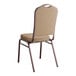 A Lancaster Table & Seating tan fabric banquet chair with a copper vein frame and cushion.