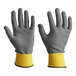 A close-up of a pair of gray and yellow Armor Guys Kyorene Pro cut-resistant gloves.