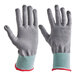 A pair of gray, cut-resistant, food-safe gloves with light blue cuffs and red trim, size extra small.