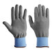 A pair of gray Armor Guys Kyorene Pro cut-resistant gloves with blue accents.