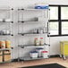 Regency galvanized steel shelves in a kitchen with food items on them.