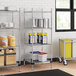 Regency chrome wire shelving with containers on the bottom shelf in a kitchen.