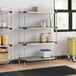 A Regency galvanized steel shelving unit in a kitchen with containers on the shelves.