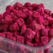 A plastic container of Dole Chef-Ready Cuts IQF Diced Pitaya Dragon Fruit.