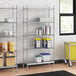 A stainless steel wire shelving unit with solid stainless steel shelves.
