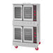 An American Range Majestic double deck natural gas convection oven on red wheels with one door open.