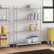A stainless steel wire shelf kit with solid stainless steel bottom shelves holding containers.