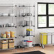 Regency NSF galvanized steel shelving in a kitchen with white and blue plastic containers.