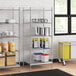 Stainless steel wire shelf kit with solid stainless steel bottom and 5 shelves in a kitchen with metal shelves and food items.