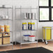A stainless steel wire shelf kit with solid stainless steel bottom shelves holding containers and buckets.