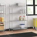 Regency chrome wire shelving with a solid metal bottom shelf and containers.