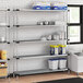 A Regency metal shelving unit in a school kitchen.